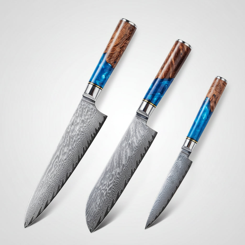Three Damascus steel knives with wooden handles on a white background