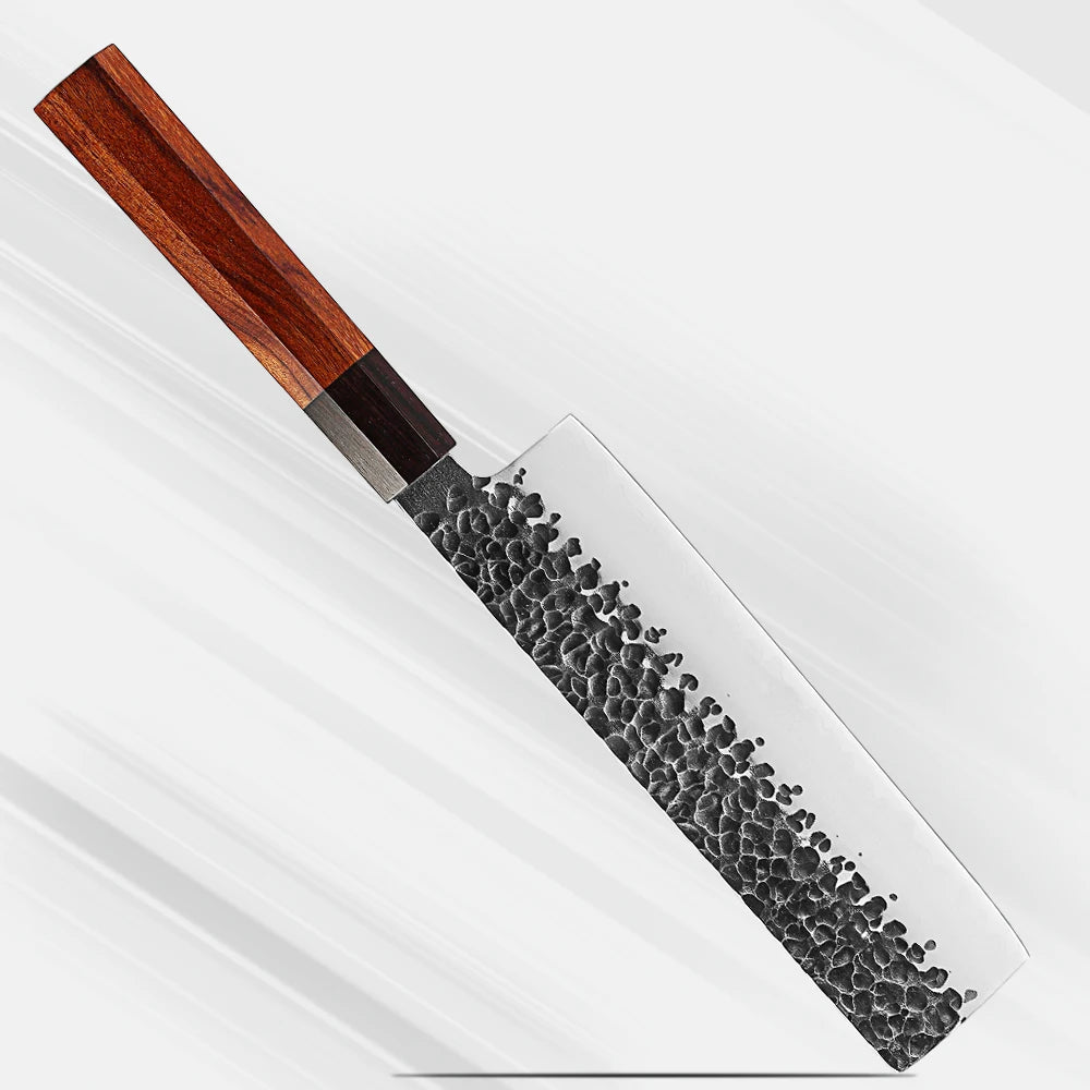 A Japanese-style kitchen knife with a hammered dark steel blade and a reddish-brown wooden handle, shown diagonally on a clean white background.