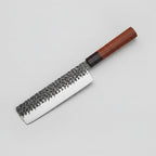 A professional kitchen knife with a hammered Damascus steel blade and a reddish-brown wooden handle, shown diagonally against a dark textured background. The brand logo 'XITUO' is visible in the top-left corner.