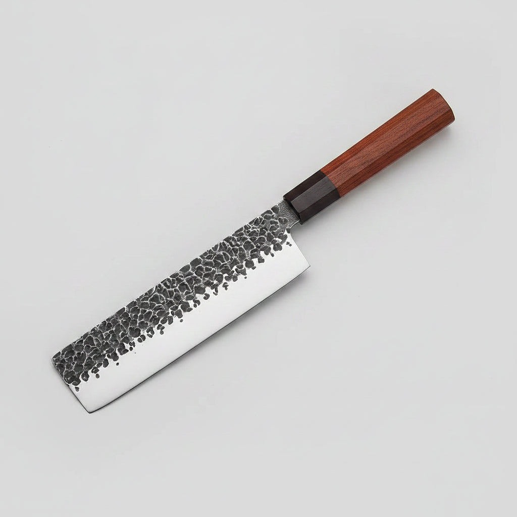 A professional kitchen knife with a hammered Damascus steel blade and a reddish-brown wooden handle, shown diagonally against a dark textured background. The brand logo 'XITUO' is visible in the top-left corner.