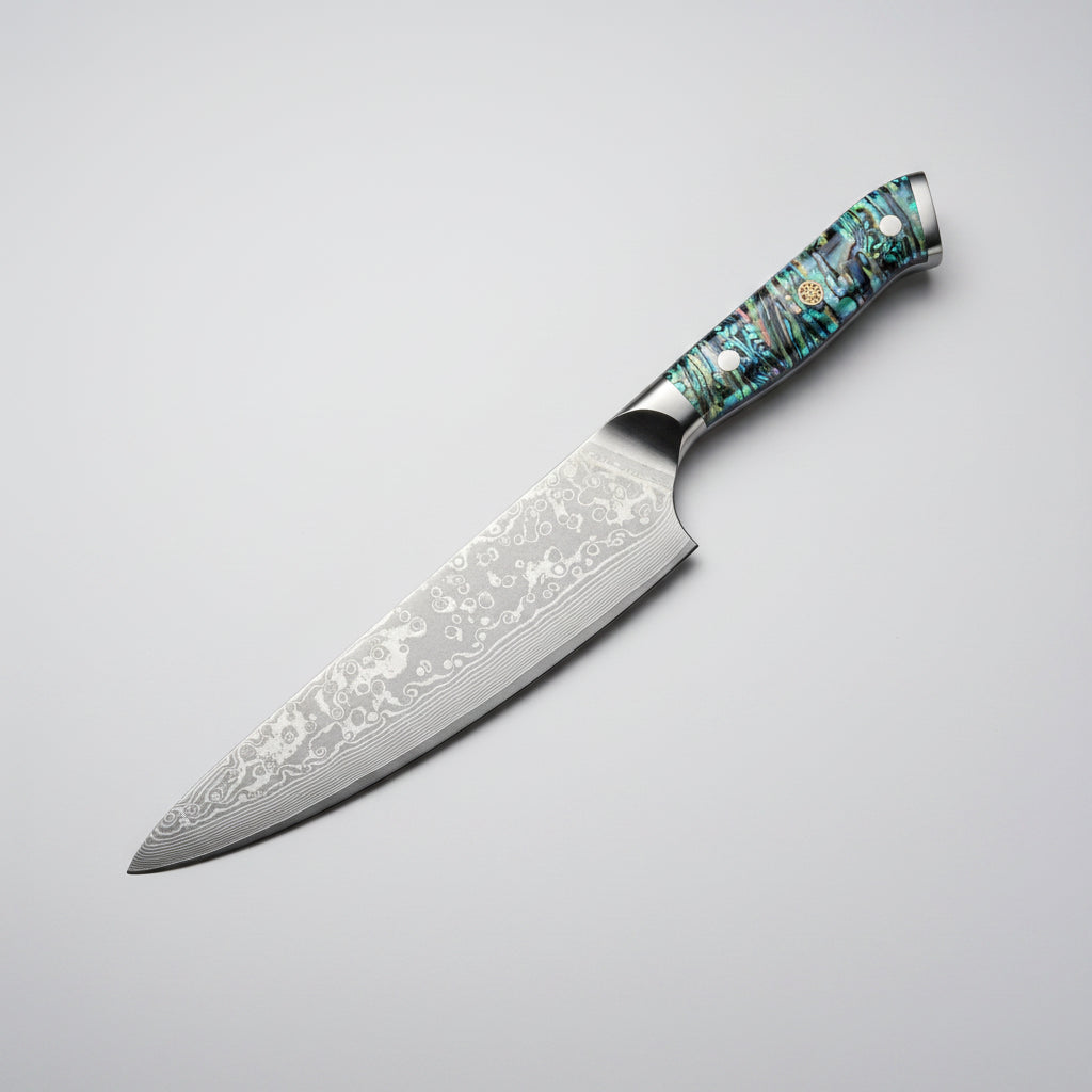 Decorative chef's knife with a patterned blade and colorful handle on a white background
