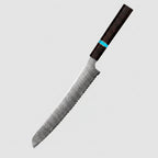 A Japanese Aus-10 style bread knife with a Damascus steel serrated blade and a dark wood handle with a turquoise accent ring, shown on a wooden surface with sliced and whole loaves of bread against a dark background. Text on the image reads 'JAPAN AUS-10 Damascus Steel Bread Knife' and 'Professional Baking Cook Tools'.