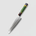 Decorative chef's knife on a wooden cutting board with fresh vegetables