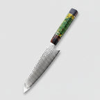 Decorative chef's knife on a wooden cutting board with fresh vegetables