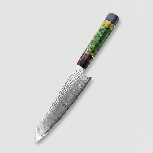 Decorative chef's knife on a wooden cutting board with fresh vegetables